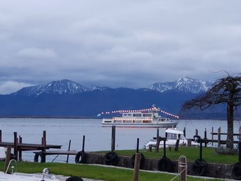 Scenic view of lake and mountains against sky