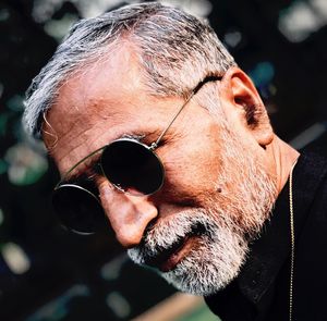 Close-up portrait of man wearing sunglasses