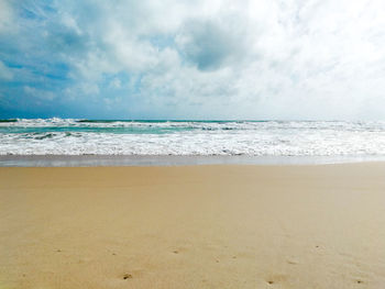 Scenic view of beach against sky