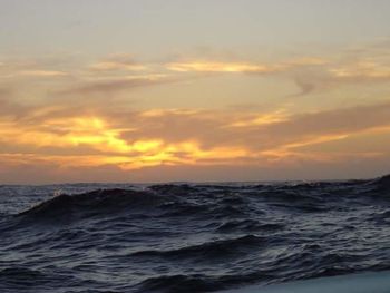 Scenic view of sea at sunset