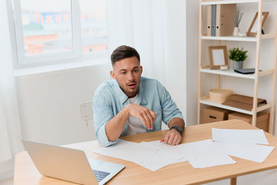 Portrait of young businesswoman working at office