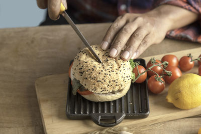 Close-up of person preparing food on table