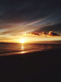 Scenic view of sea at sunset