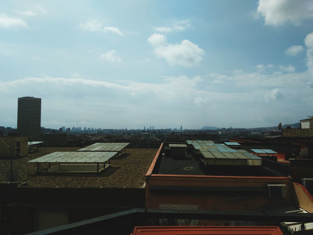 building exterior, architecture, built structure, sky, roof, city, cloud - sky, residential structure, high angle view, residential building, cloud, cityscape, day, residential district, crowded, house, outdoors, cloudy, no people, building