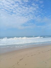 Scenic view of beach against sky