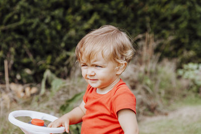 Close-up of baby girl looking away