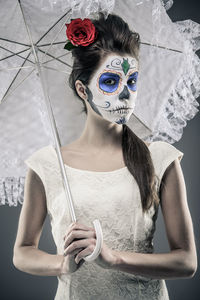 Young woman standing on mask