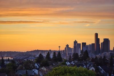 Cityscape against sky during sunset