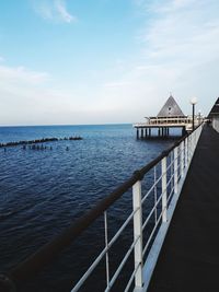 Pier over sea against sky