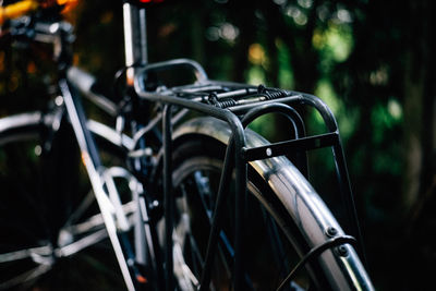 Close-up of bicycle parked on field