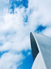 Low angle view of airplane flying against sky