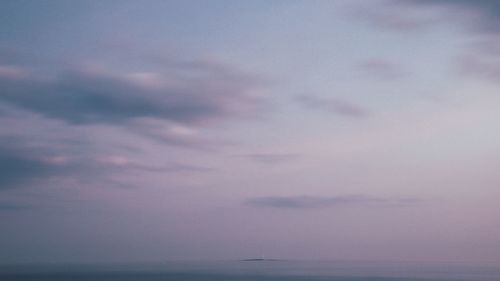 Scenic view of sea against sky at sunset