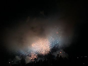 Firework display at night