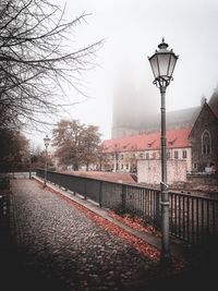 Street amidst buildings against sky