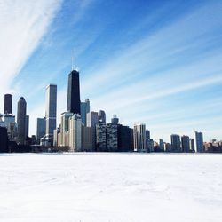 City skyline against cloudy sky