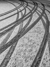 High angle view of tire tracks on snow covered road
