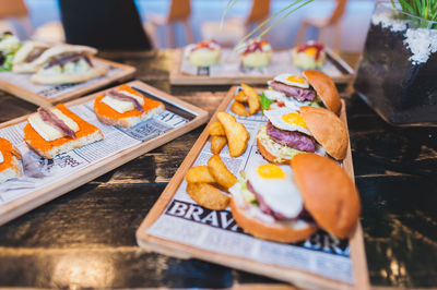 Close-up of burger and french fries on plate at restaurant