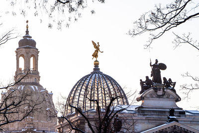Low angle view of statue of building against sky