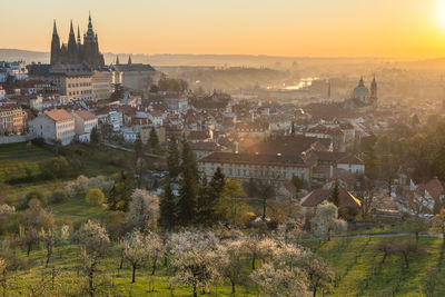 High angle shot of prague townscape against sky at sunrise 