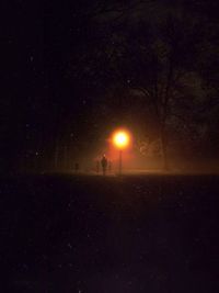 Scenic view of landscape against sky at night