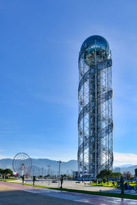 Low angle view of skyscrapers against clear blue sky