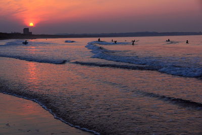 Scenic view of sea at sunset