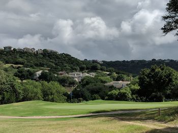 High angle view of golf course against sky