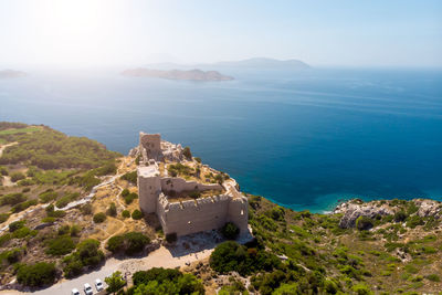 High angle view of sea and buildings against sky