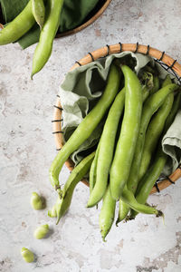 High angle view of green chili peppers on table