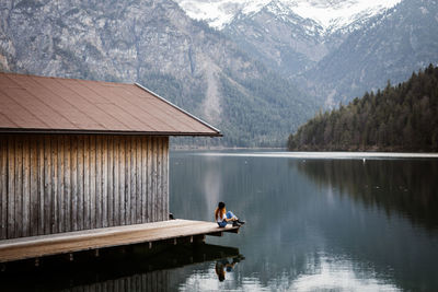 Man on lake against mountain