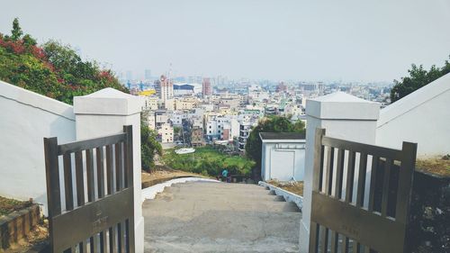 Buildings in city against clear sky