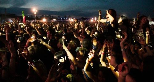 People enjoying music concert at night