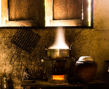 Burning candles on barbecue grill at home