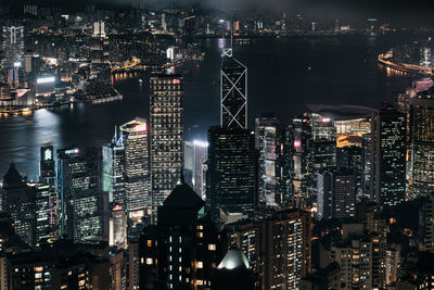 High angle view of illuminated city buildings at night