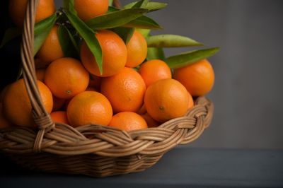 High angle view of oranges in basket on table