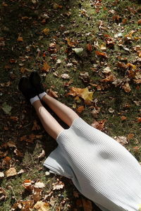 Low section of person legs on field during autumn