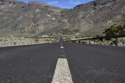 Surface level of road against mountain range