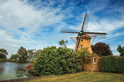 Traditional windmill against sky