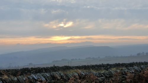 Scenic view of landscape against sky during sunset