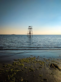 Scenic view of sea against clear sky