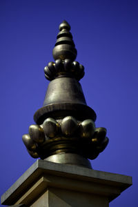 Low angle view of tree against blue sky