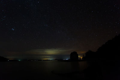 Silhouette built structure against sky at night