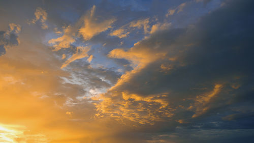 Low angle view of dramatic sky during sunset