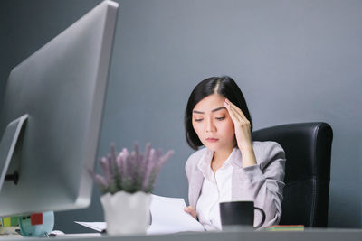 Young woman working on table