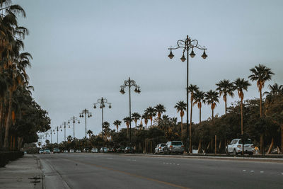 Cars on road against clear sky