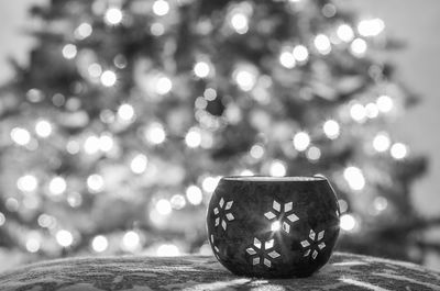 Close-up of illuminated christmas tree on table