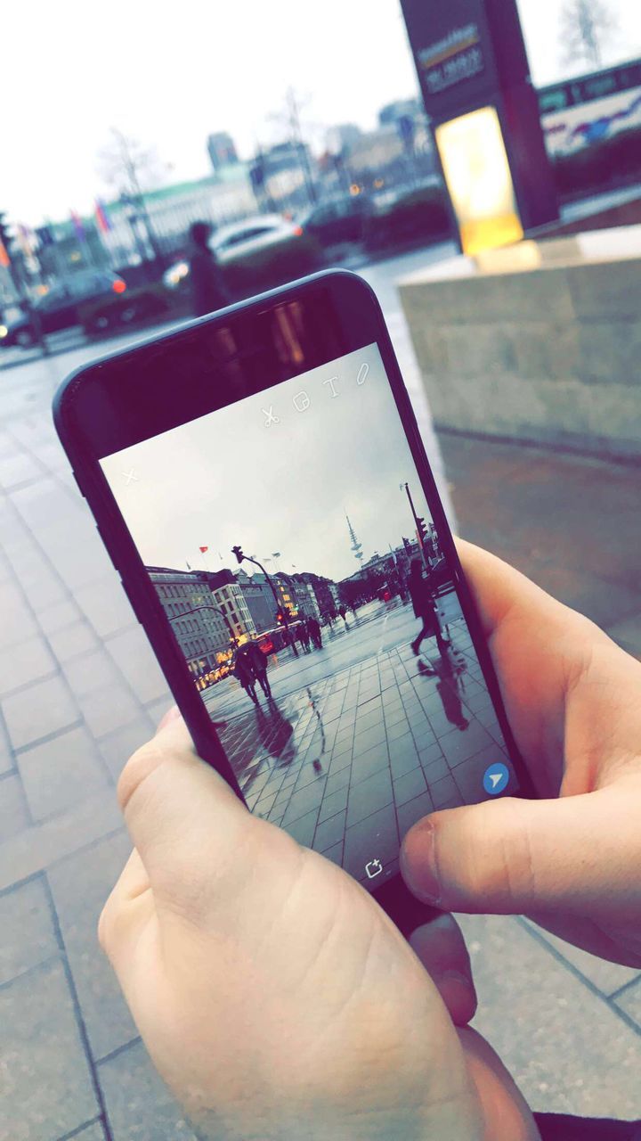 human hand, holding, close-up, technology, focus on foreground, one person, wireless technology, human body part, women, adults only, adult, people, real people, modern, only women, day, indoors, architecture