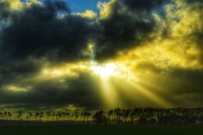 Scenic view of landscape against cloudy sky