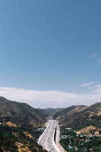 High angle view of landscape against blue sky