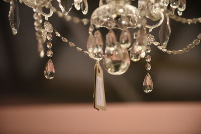 Close-up of chandelier with price tag